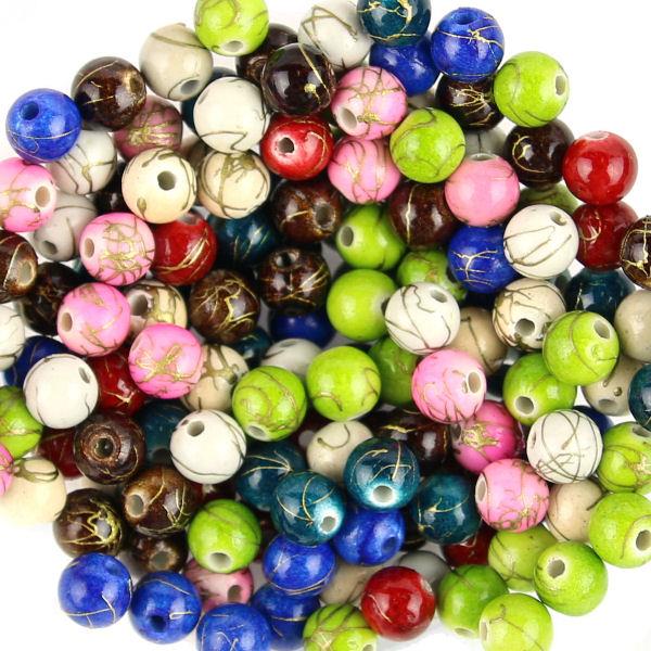 50 Perle tonde 6mm schizzi dorati - colore: MISTE