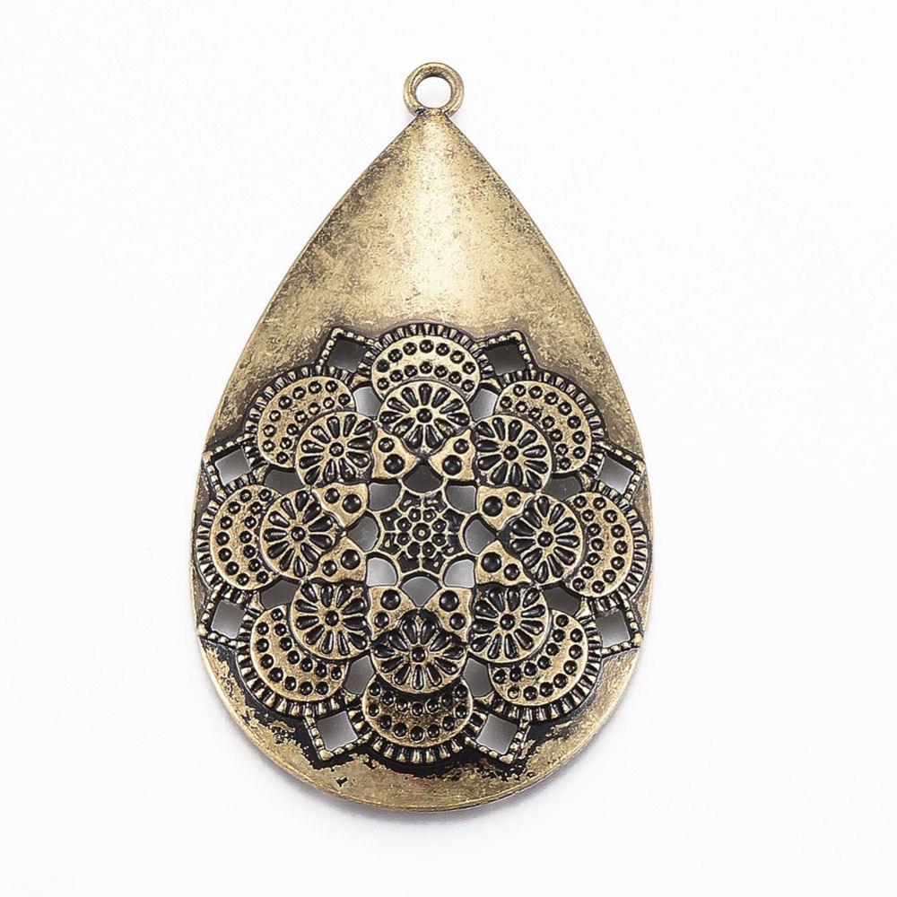 CIONDOLO INTAGLIATO CON UN MANDALA CIONDOLO INTAGLIATO CON UN MANDALA